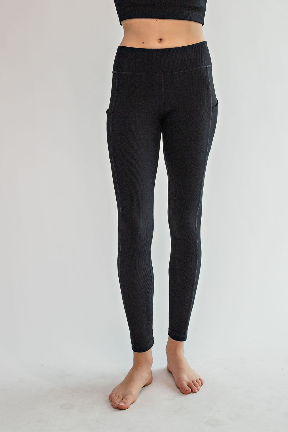 Model wearing Rally Ribbed Yoga Leggings – full length with side pockets
