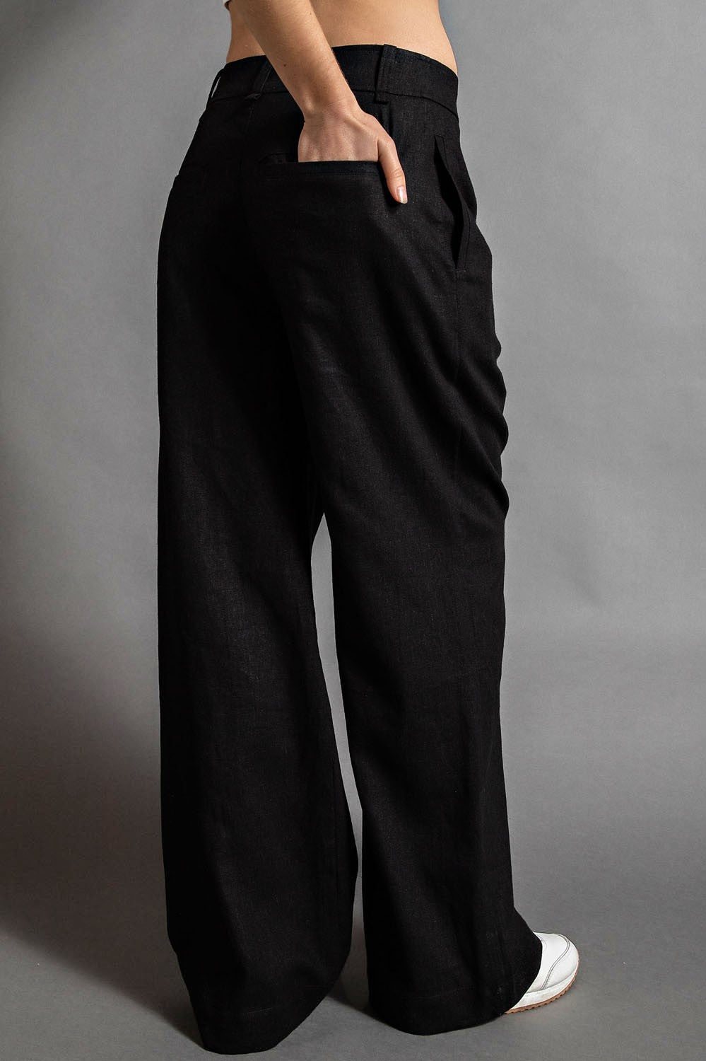 Model wearing McCall Linen Wide Leg Pleated Pants with pintuck and side pockets