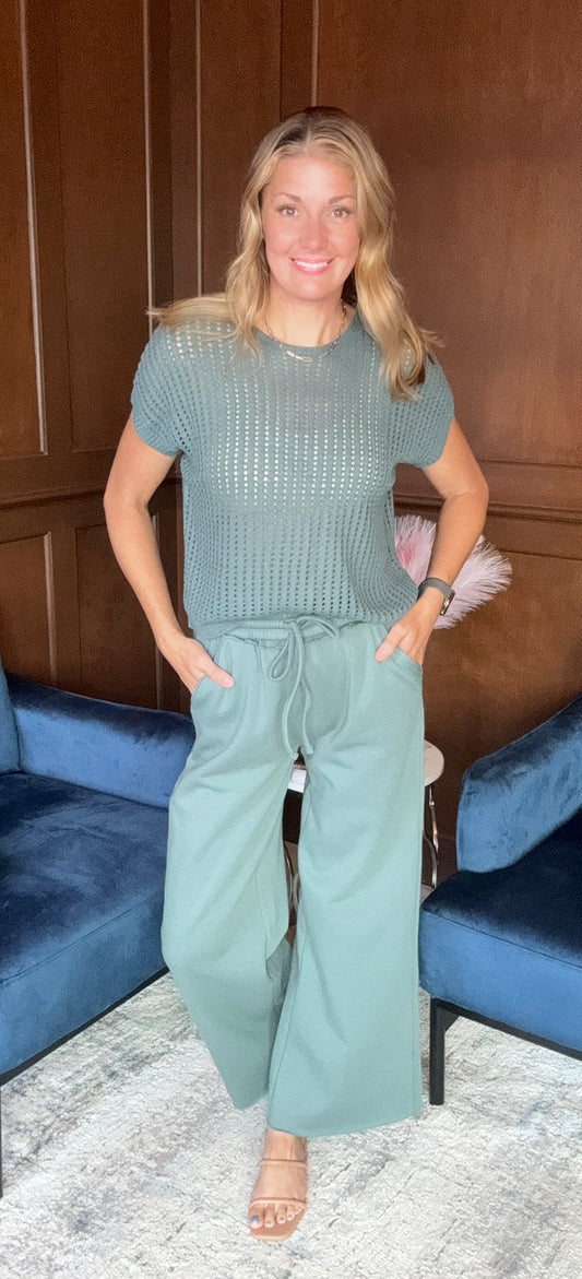 Evelyn wide leg sweatpants with exposed seam detail in soft fabric
Emma crochet short sleeve sweater with open weave detail