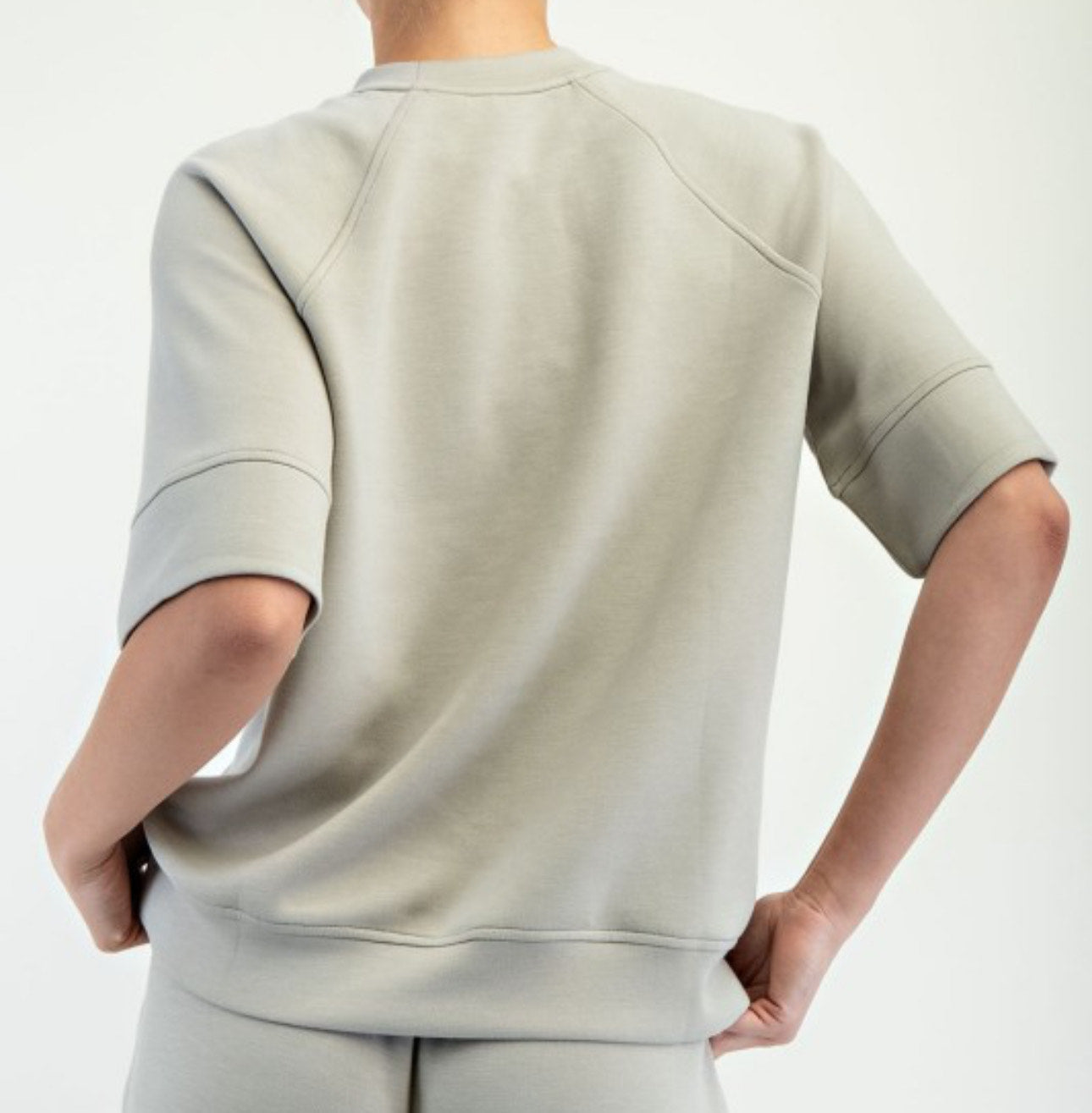 Model wearing Reva Modal Scuba Sweatshirt with oversized 3/4 sleeves and relaxed fit