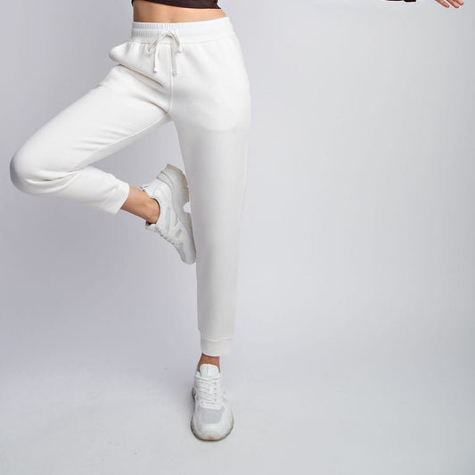 Model wearing Rebel French Terry Sweatpants with drawstring waist and side pockets

