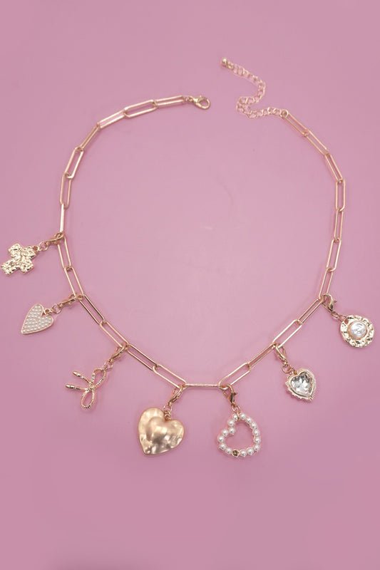 Gold-plated rhinestone rose and pearl charm toggle necklace on paperclip chain

