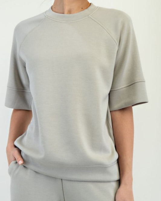 Model wearing Reva Modal Scuba Sweatshirt with oversized 3/4 sleeves and relaxed fit

