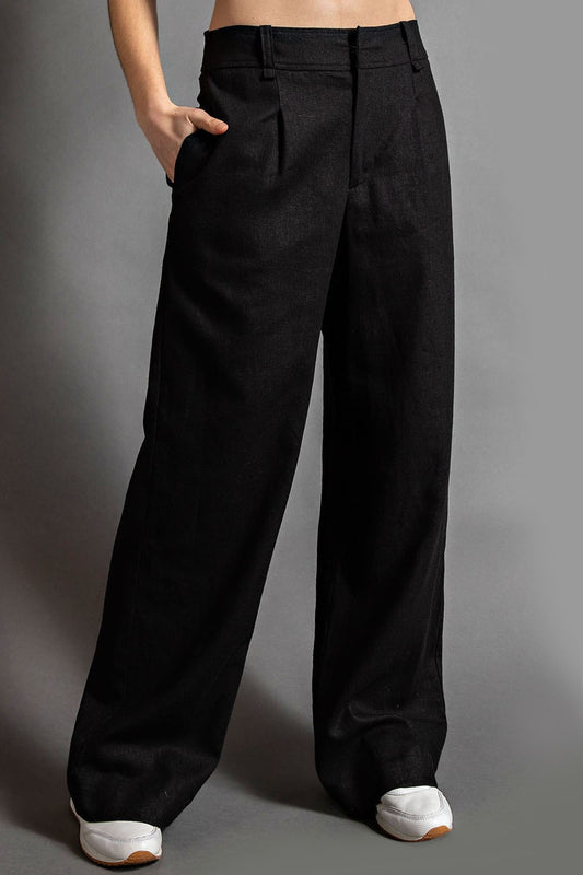 Model wearing McCall Linen Wide Leg Pleated Pants with pintuck and side pockets

